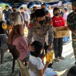 Vaksinasi Massal Polda Gorontalo Bagikan Sembako dan Minyak Goreng